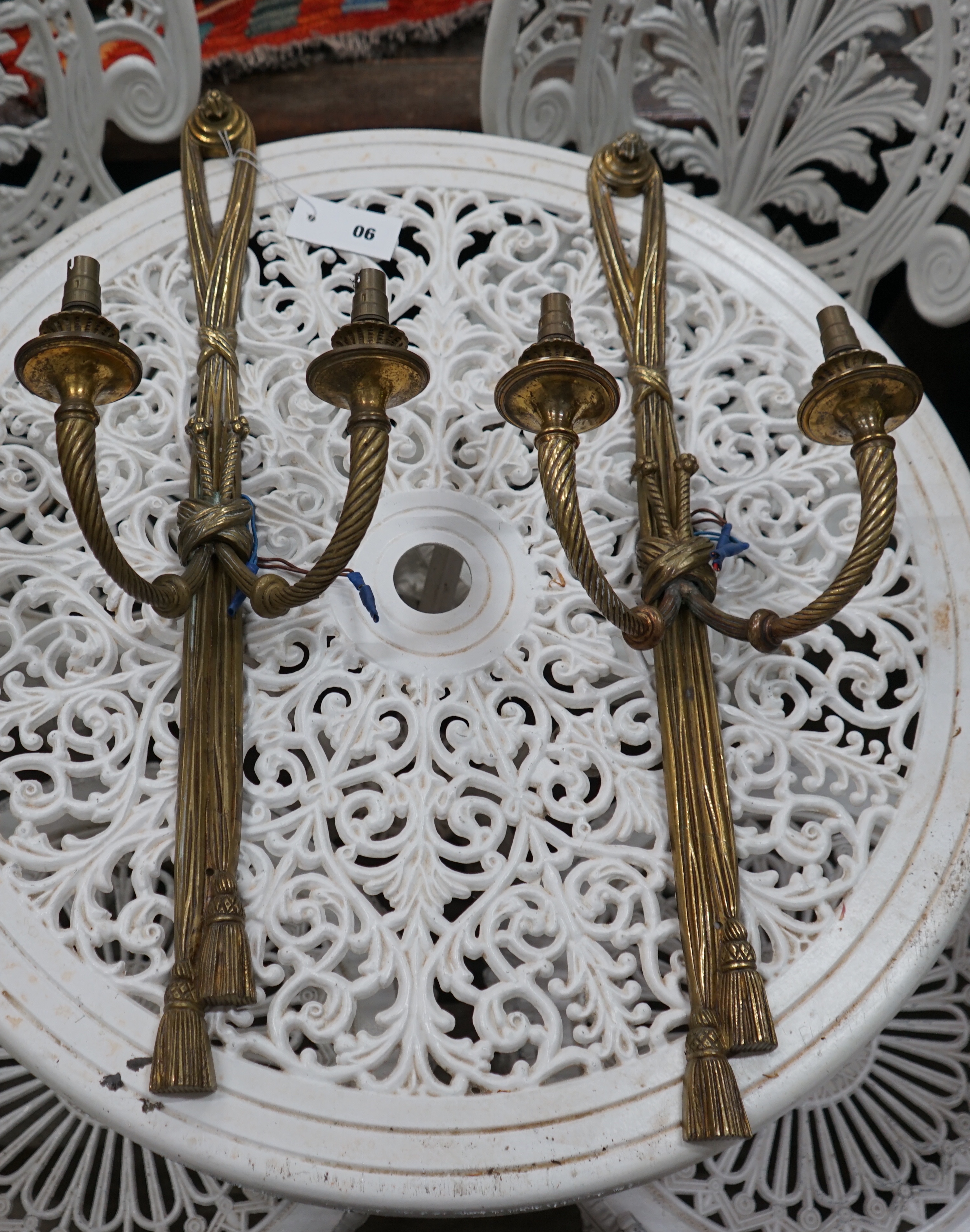A pair of gilt metal two branch wall lights, height 64cm